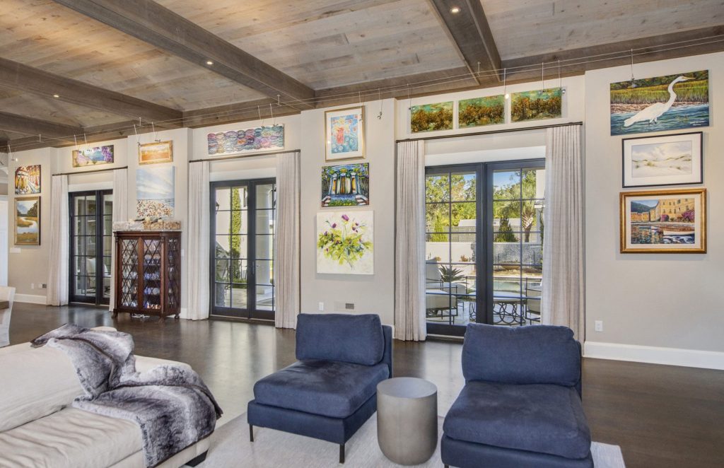 This Charleston interior design project meets mediterranean luxury with art from the clients' travels being woven into the decor.