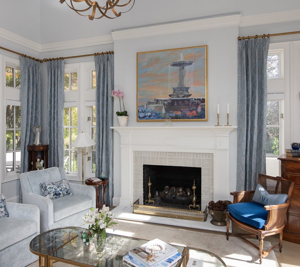 This living room is the epitome of a timeless coastal interior design with light blues and neutral walls