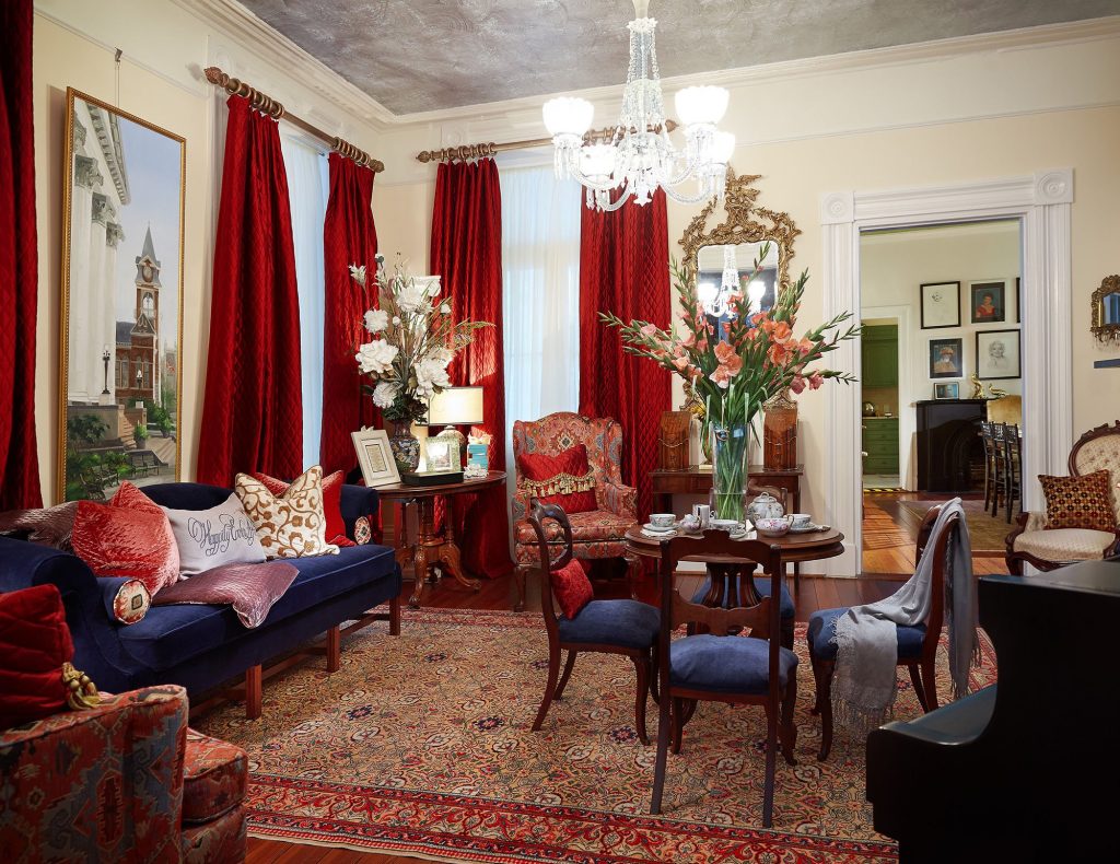 Debby Gomulka gave new life to this wedding venue on 50 Hassell St. This historic home interior design project features dramatic floor to ceiling drapery and antique furnishings.